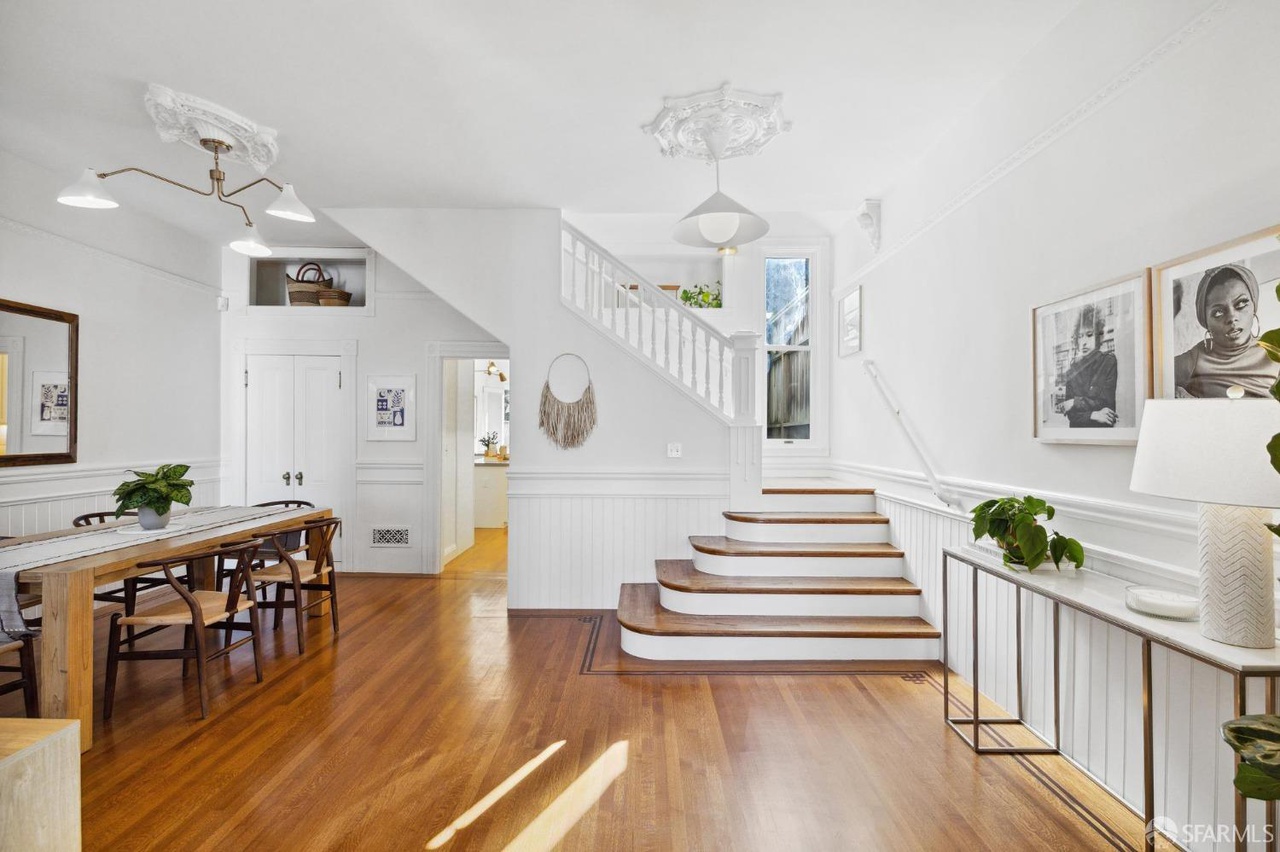 Property Photo: Main entry has dining room to the left and a staircare to the right.