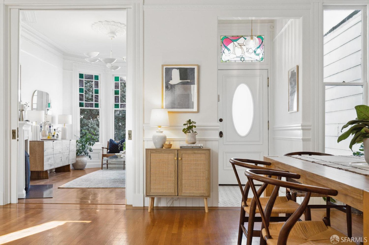 Property Photo: Main entry door has beautiful stained glass window above.