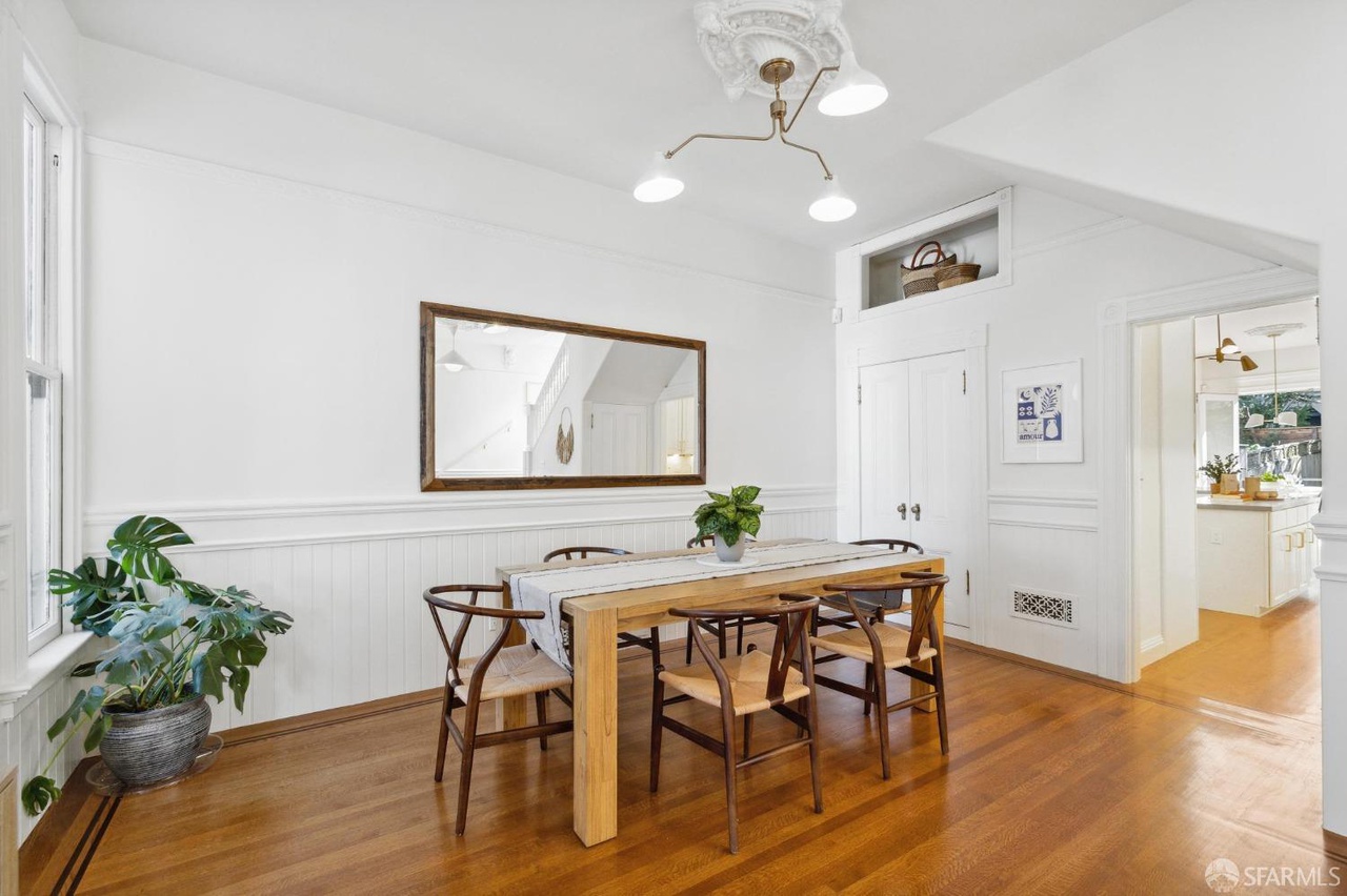 Property Photo: Dining table seats 6 and there is a built in cabinet to the right.