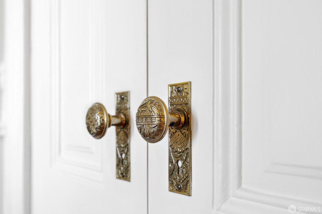 Property Photo: Close up shot of the vintage door knobs. 