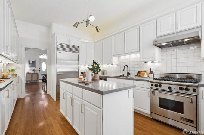 Property Thumbnail: Kitchen has hardwood floors throughout and stainless steel appliances. 