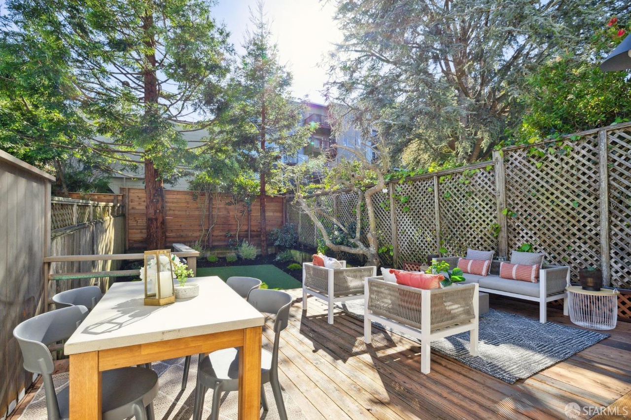 Property Photo: Outdoor area has deck with room for table and separate sitting area.