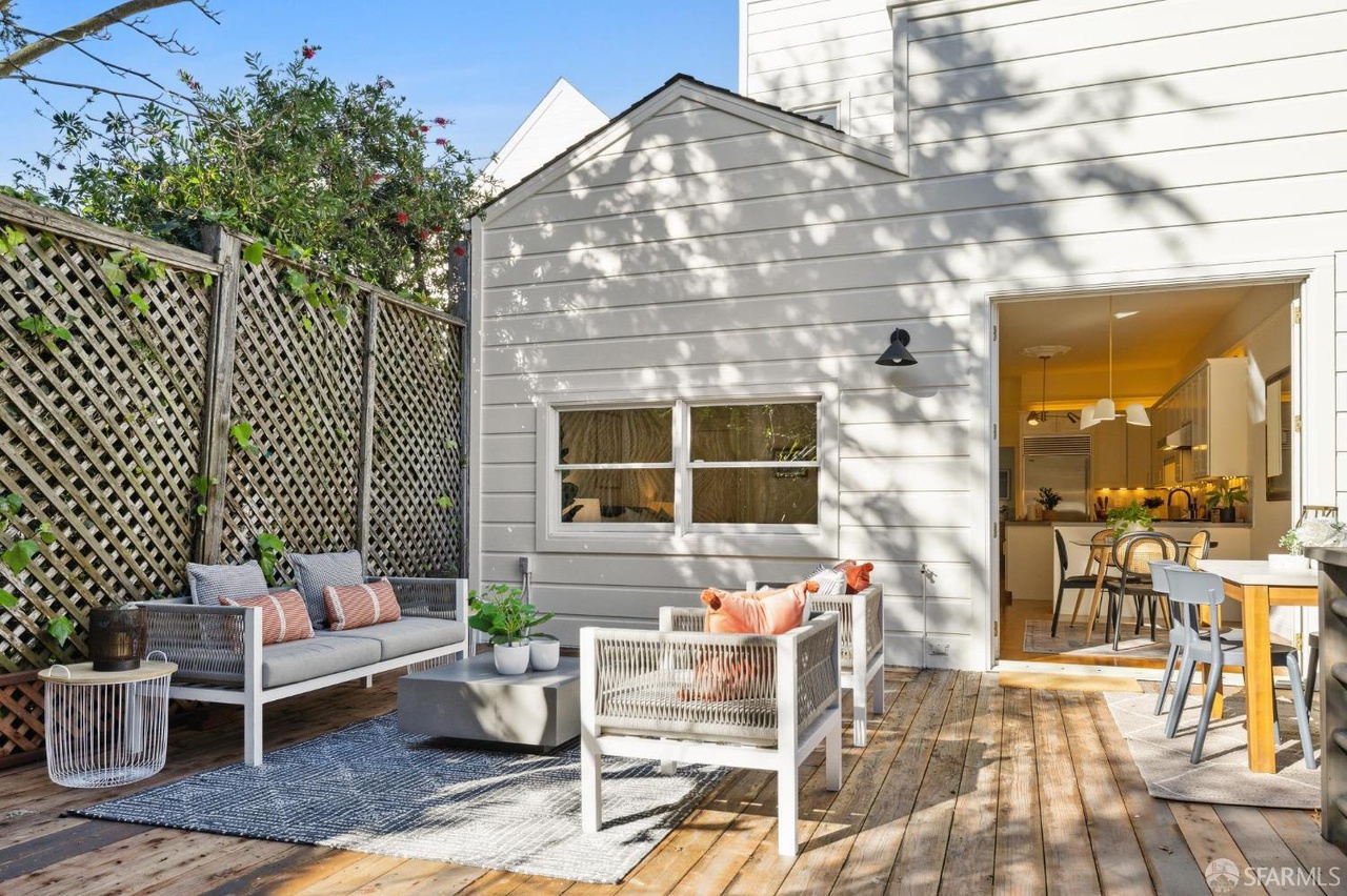 Property Photo: Looking over deck area to rear of home. 