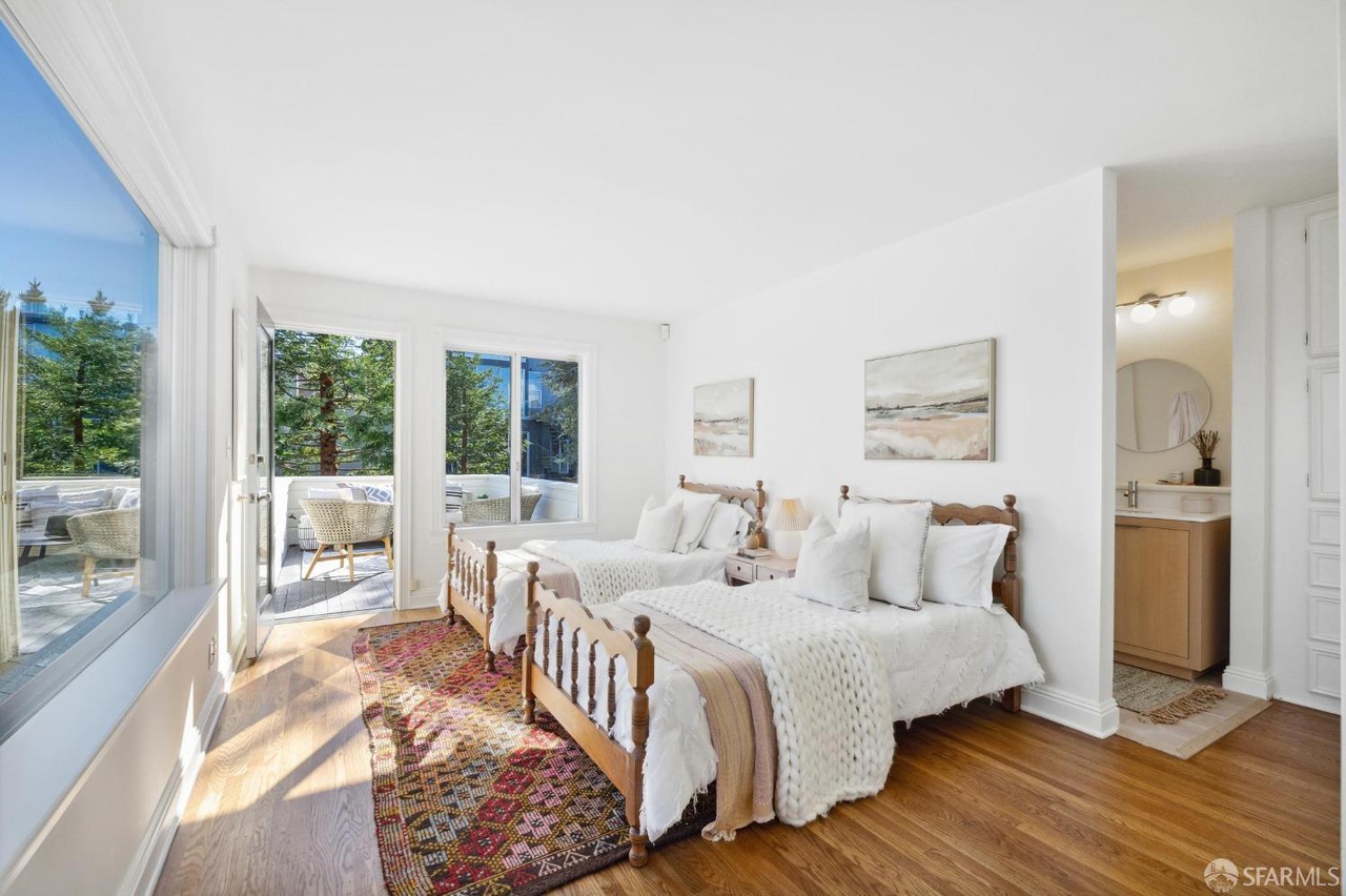 Property Photo: Guest room with 2 double beds. Also has french doors that open up to outdoor patio.