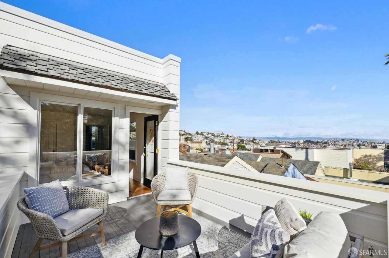 Property Photo: Views all the way to the bay from upper patio off the guest bedroom.