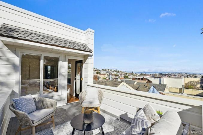 Property Thumbnail: Views all the way to the bay from upper patio off the guest bedroom.