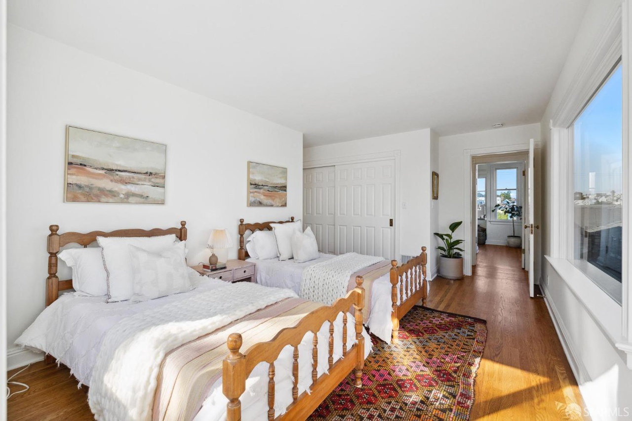 Property Photo: Looking in over guest bedroom from patio. 