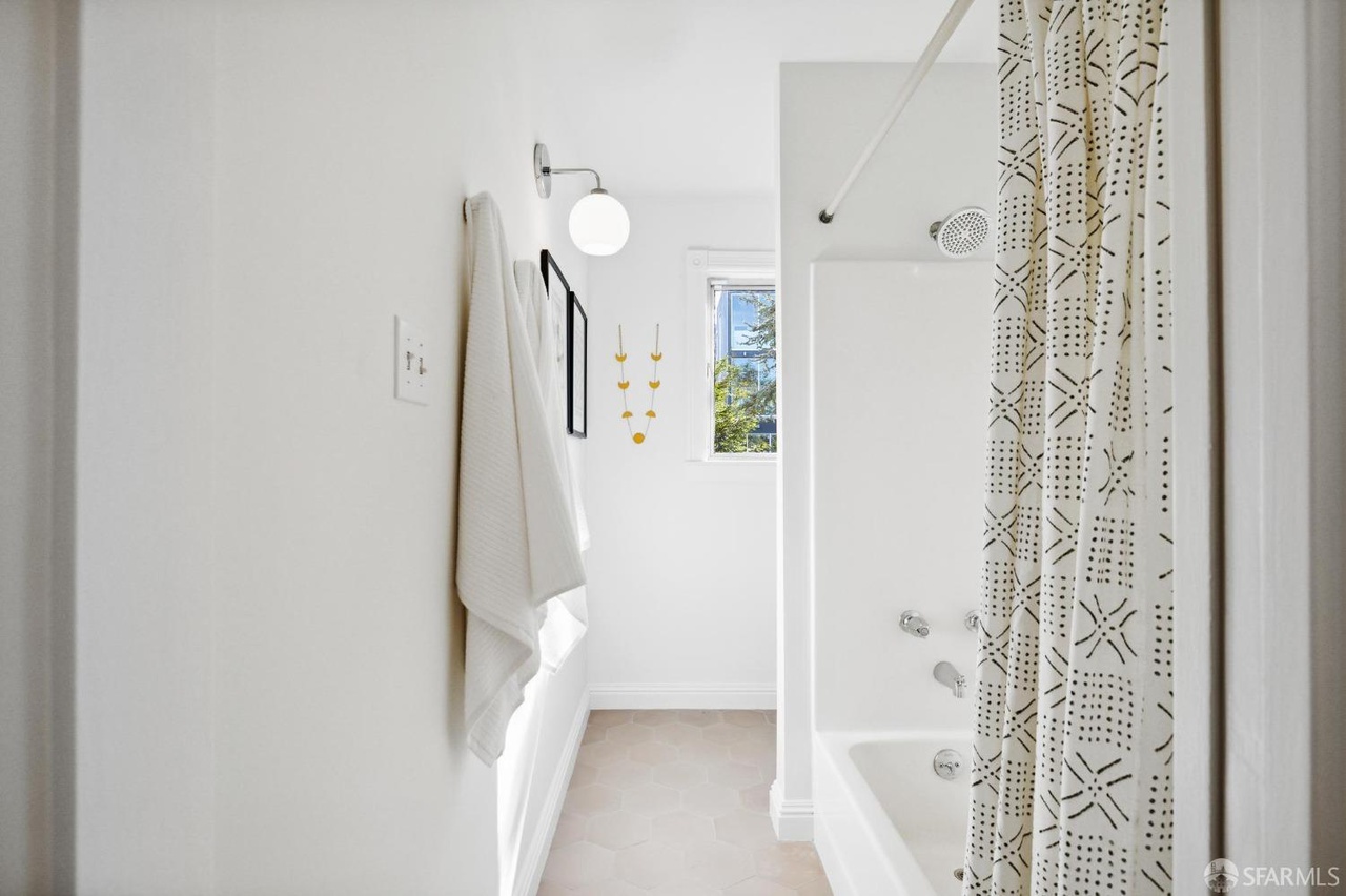 Property Photo: Shower/bath combo in guest room bath. 