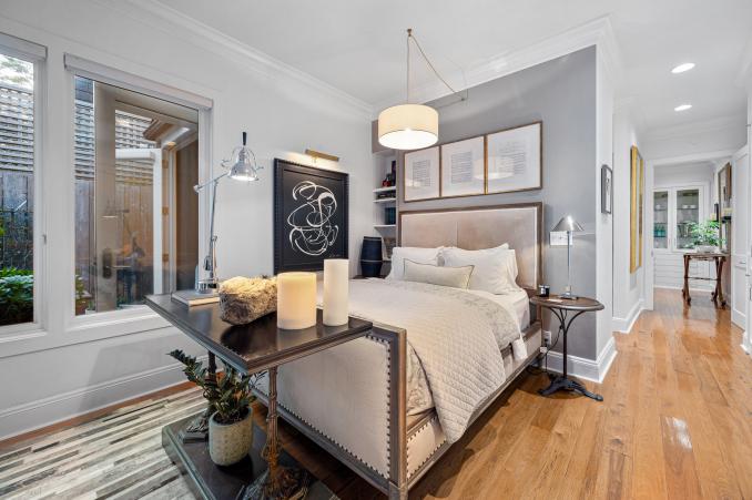Property Thumbnail: Bedroom has queen bed and a light grey accent walls. 