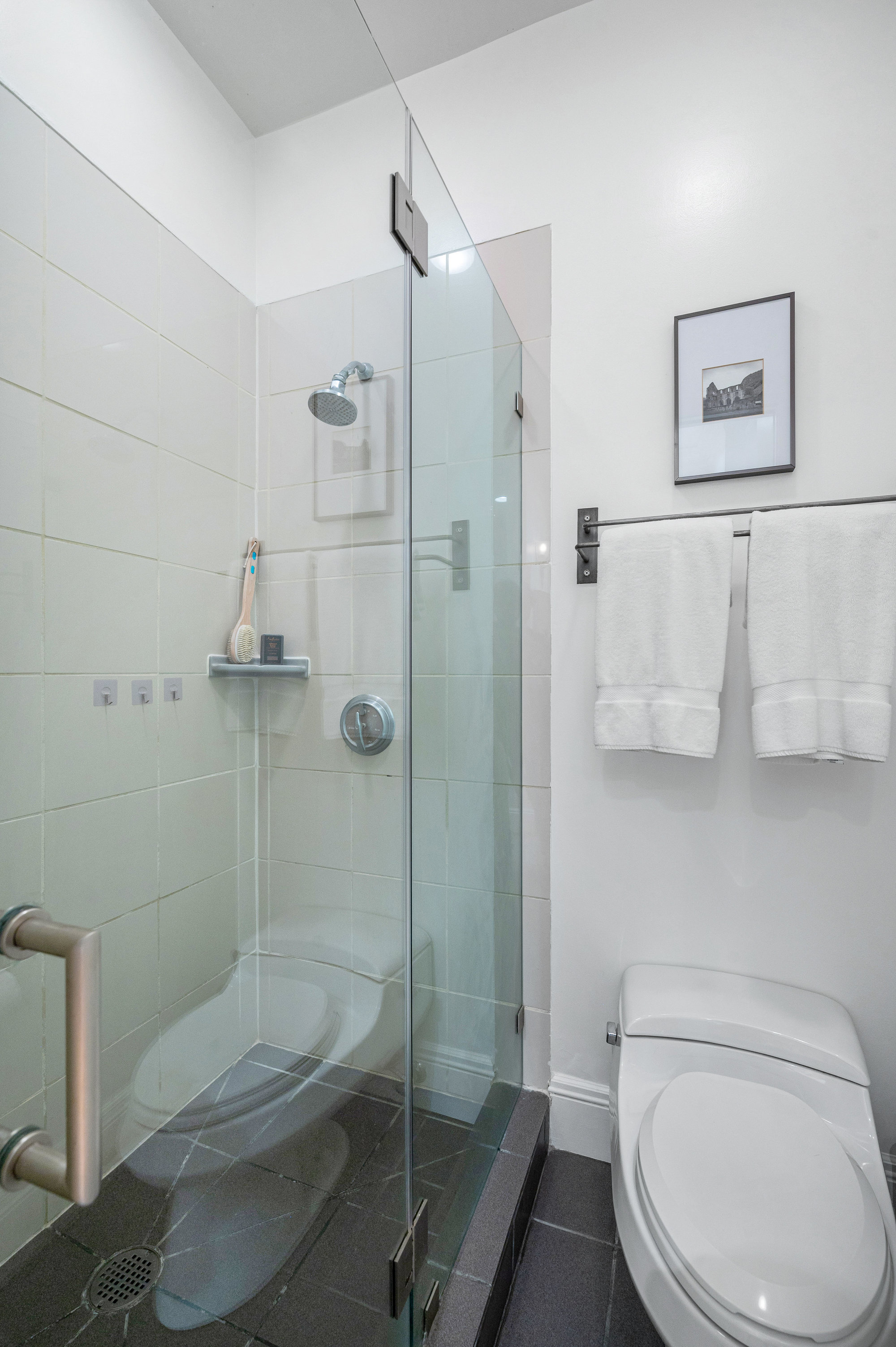 Property Photo: Bathroom has stand up shower with glass doors. 