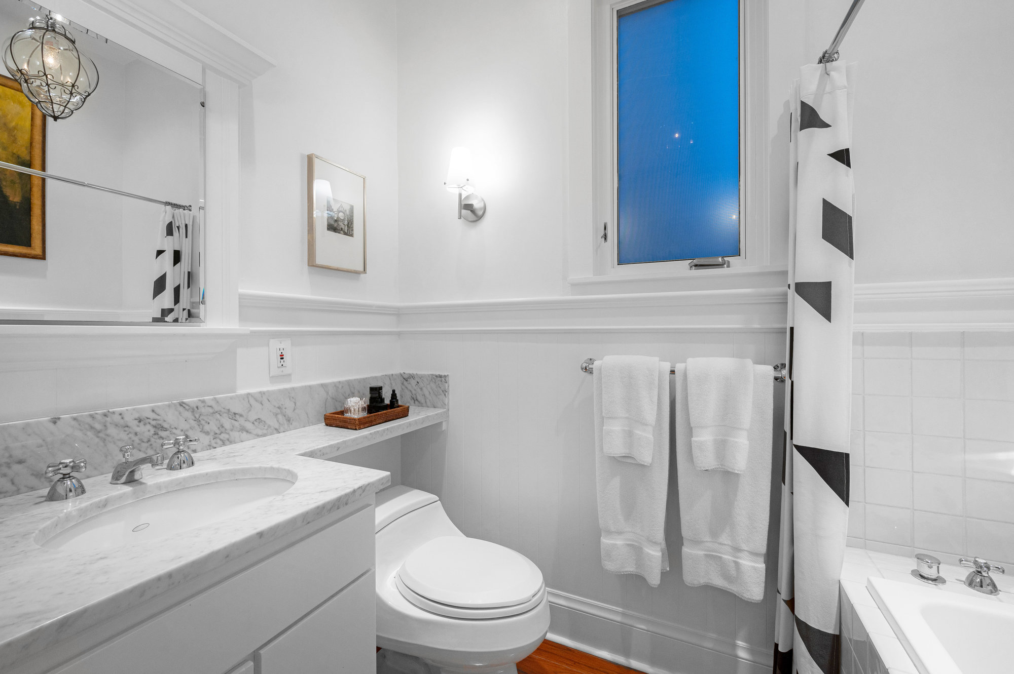 Property Photo: Guest bath has tub/shower combo. 