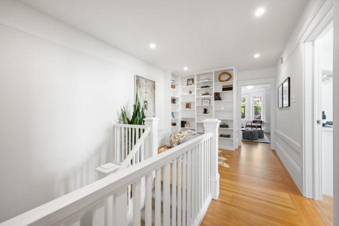 Property Thumbnail: Entryway at top of stairs. There is beautiful wood built-ins.