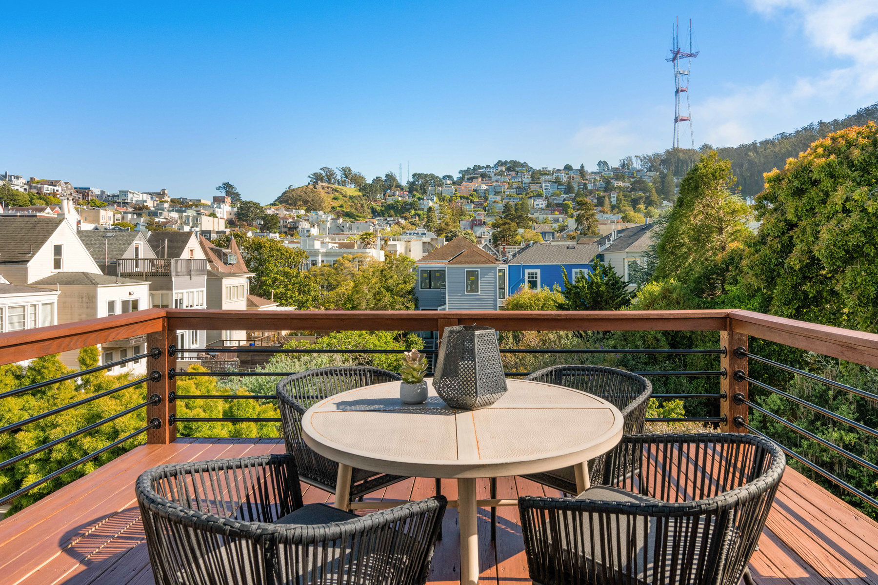 Property Photo: Deck off the back of unit with small table and beautiful views up to Sutro Tower. 