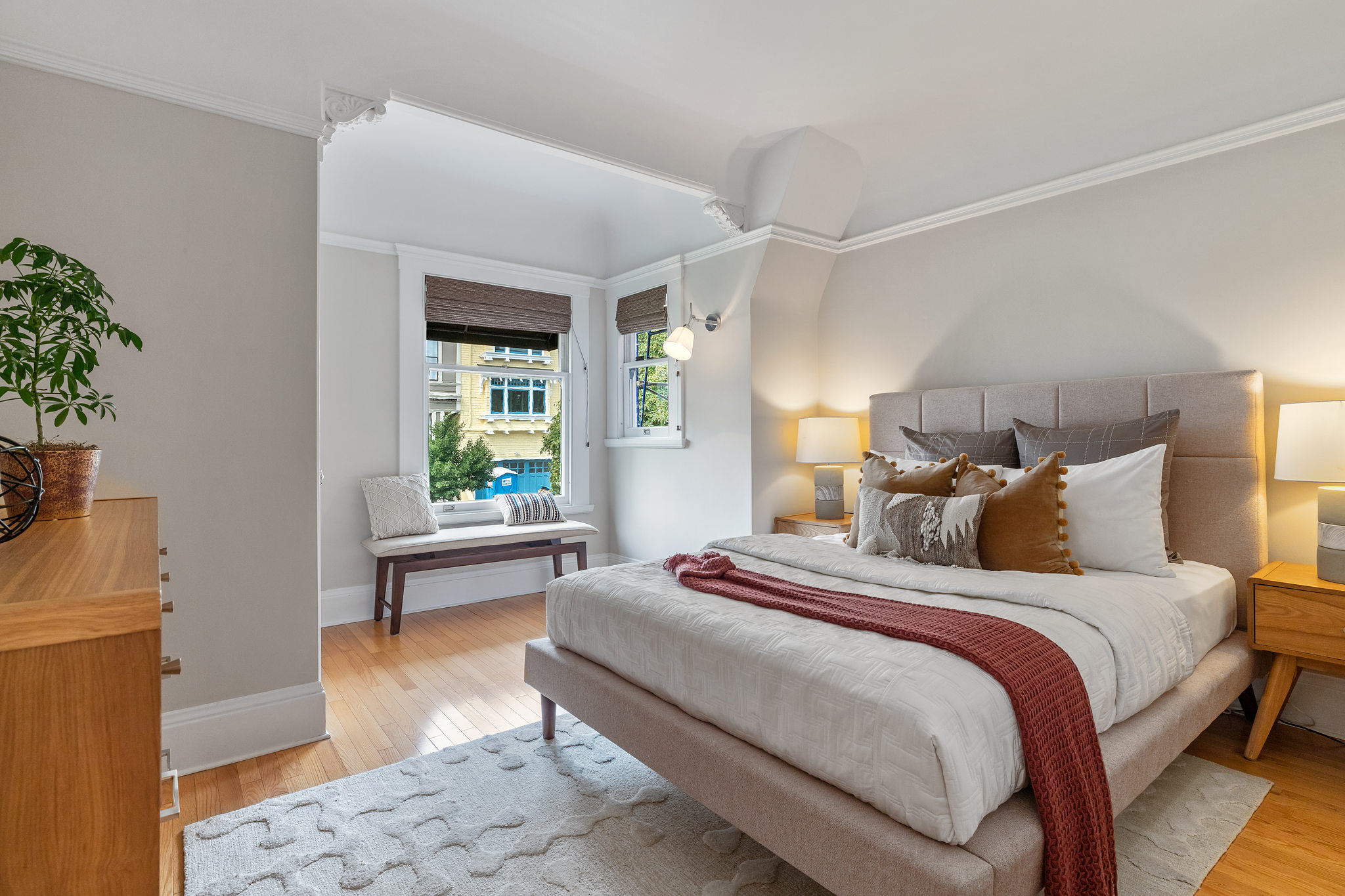 Property Photo: Large bedroom, with wood floors and sitting area