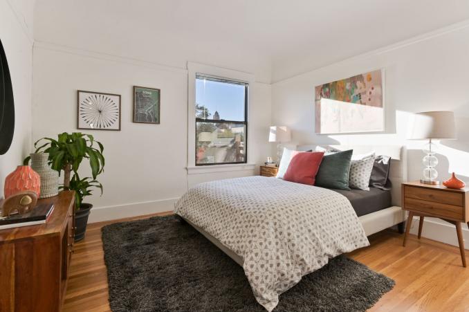 Property Thumbnail: Bedroom with wood floors and a large window