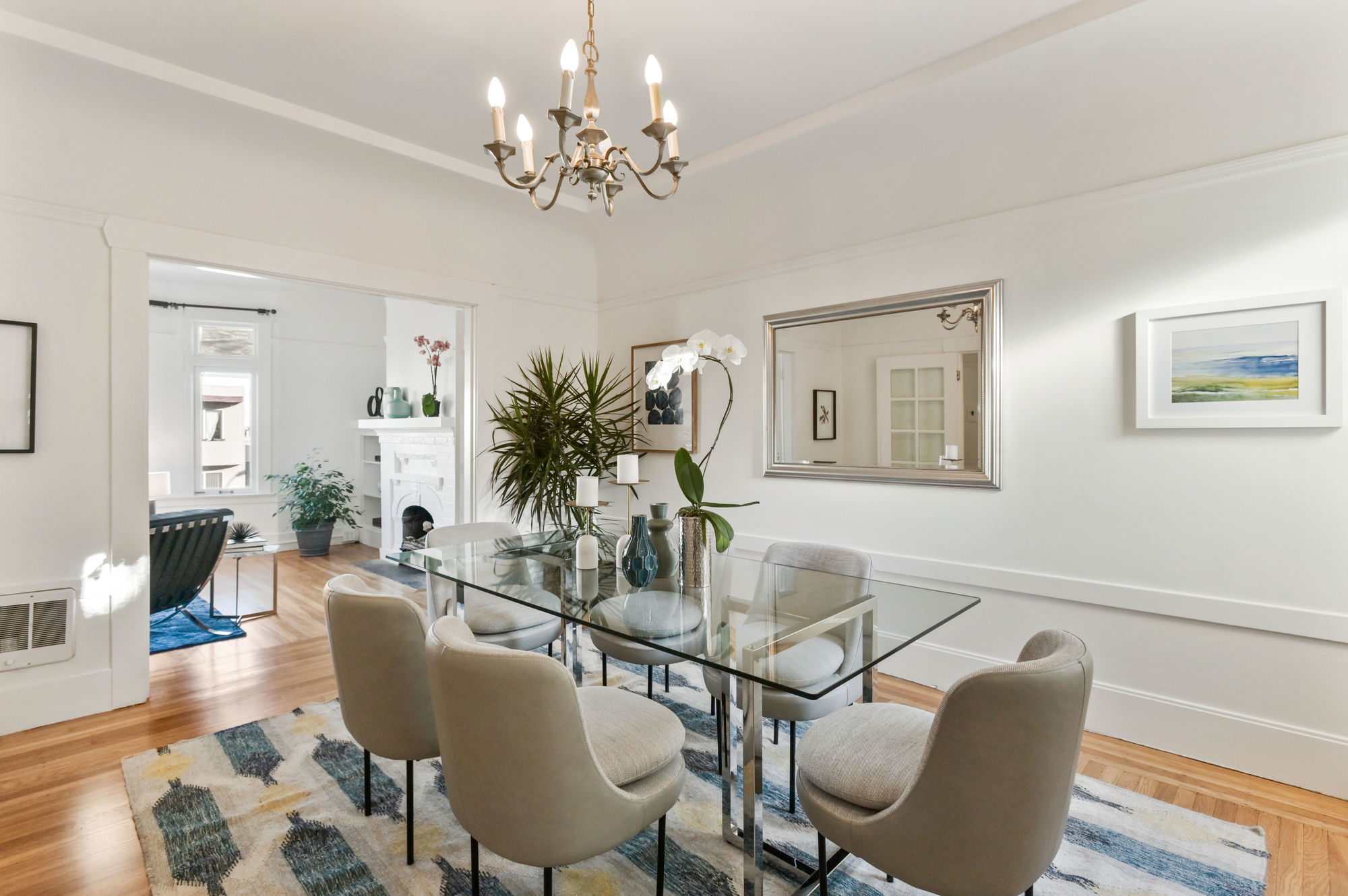 Property Photo: Formal dining area with wood floors and white walls