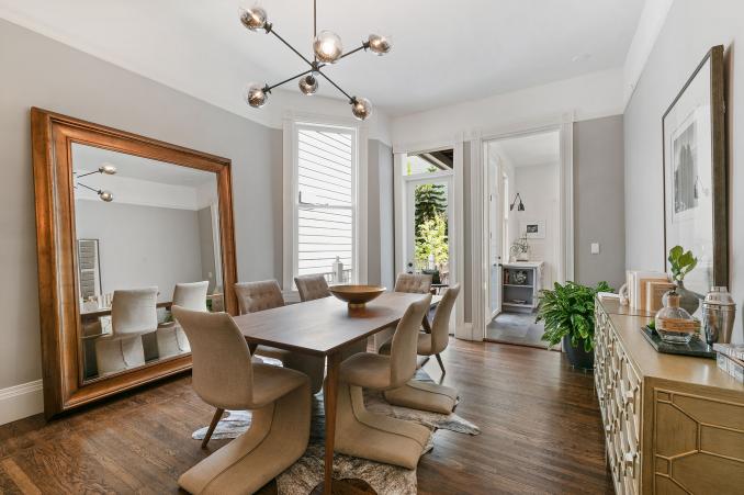 Property Thumbnail: View of the large formal dining room, featuring two windows and wood floors