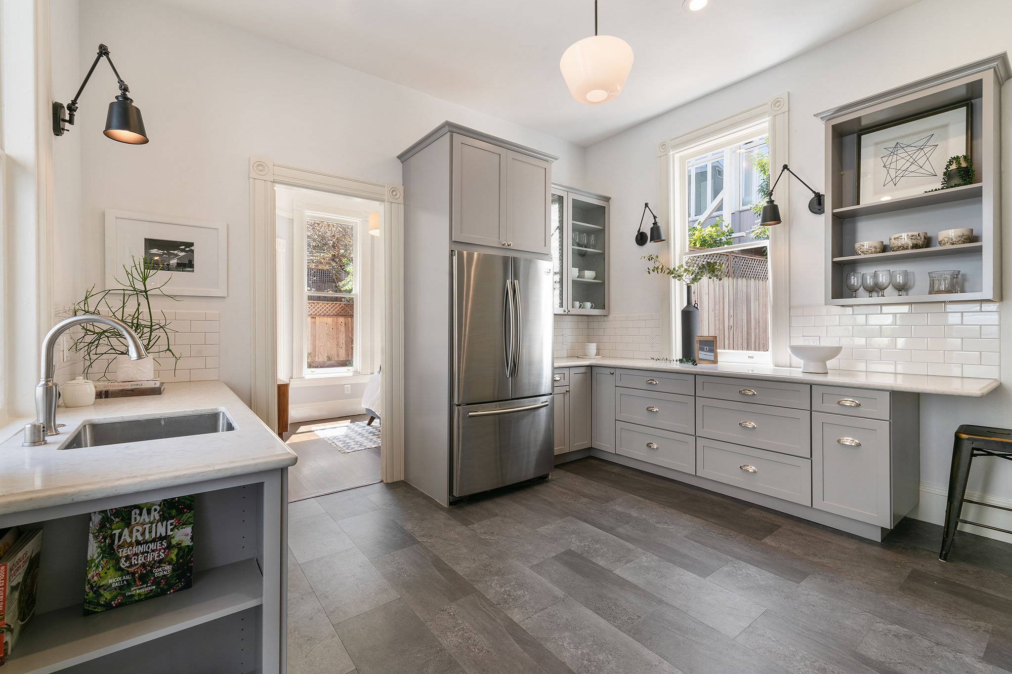 Property Photo: Kitchen, featuring grey cabinets and tiled floor