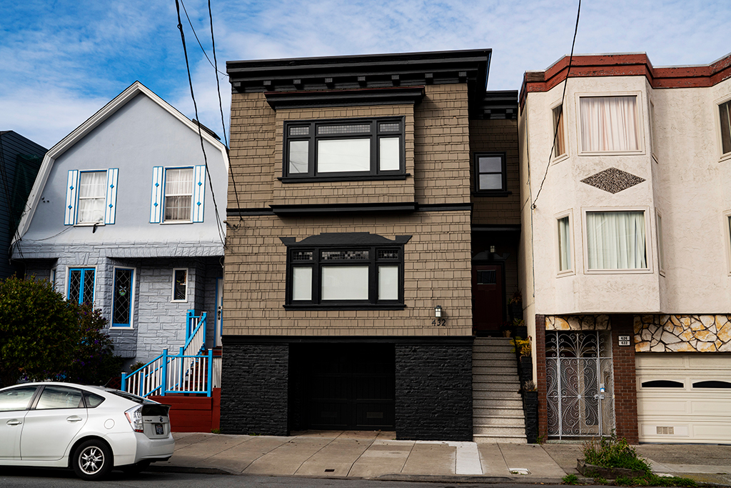 Property Photo: Front exterior view of 432 Lawton Street, featuring a brown shingled facade