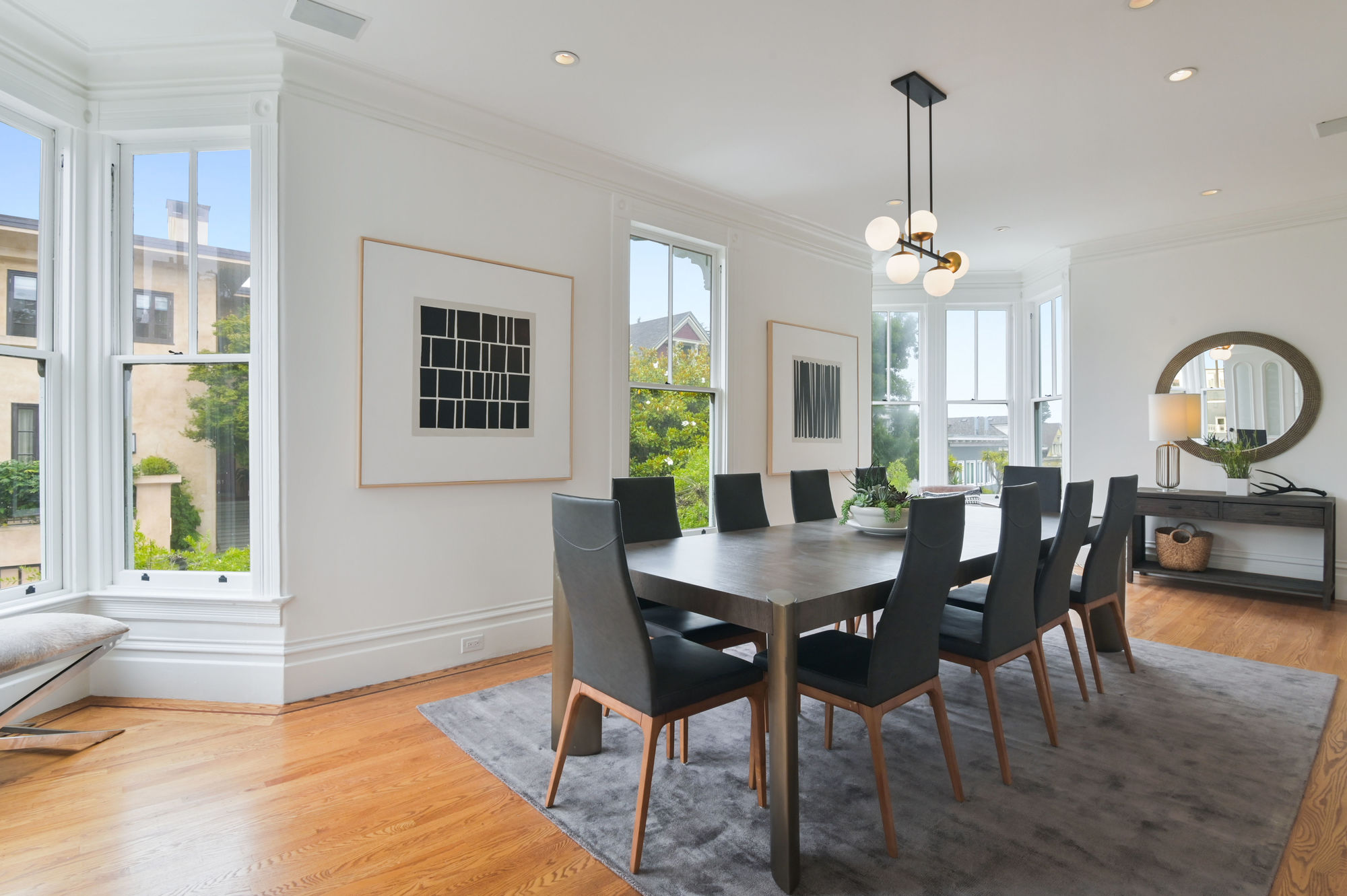 Property Photo: View of a formal dining room with wood floors and plenty of natural light