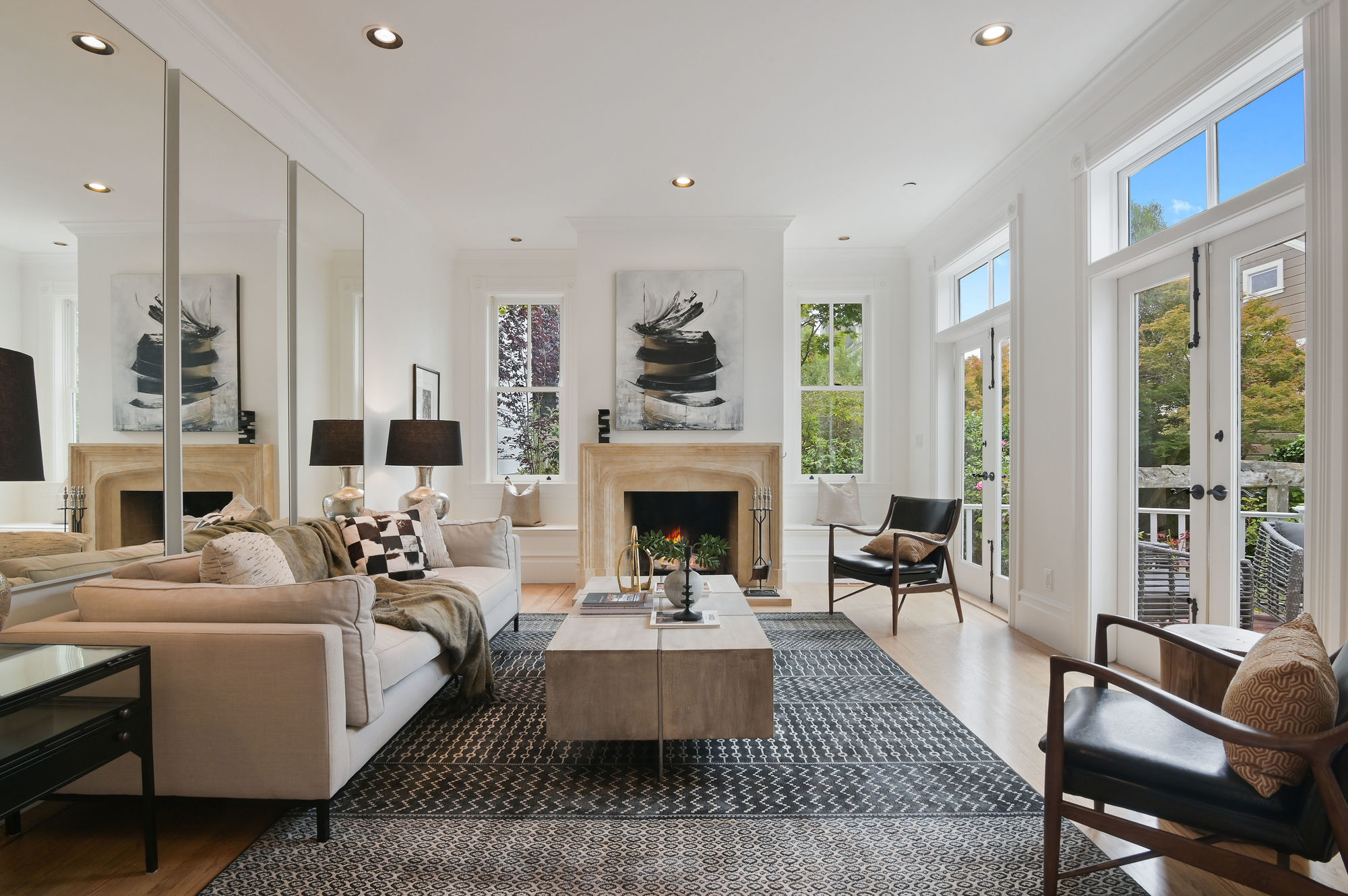 Property Photo: Living room with wood floors and double french doors