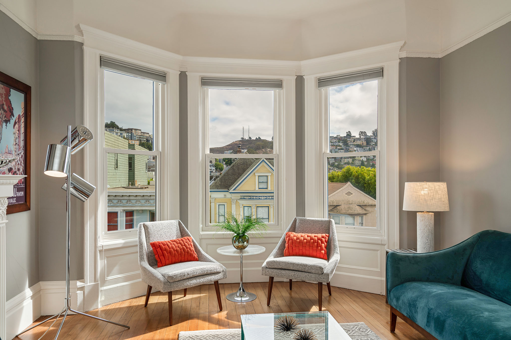 Property Photo: Living room, featuring a large bay window