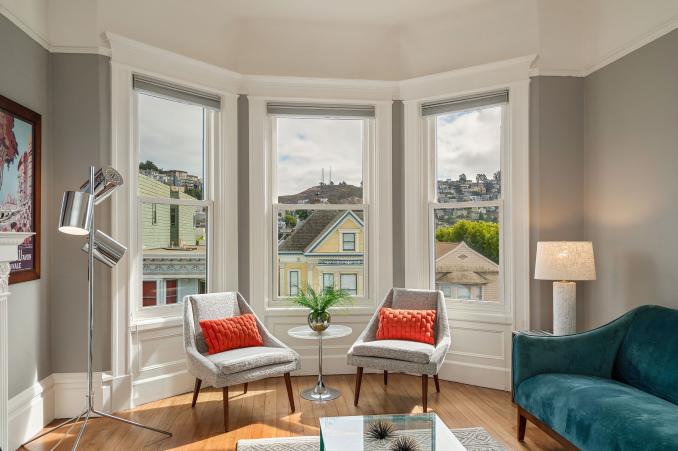 Property Thumbnail: Living room, featuring a large bay window