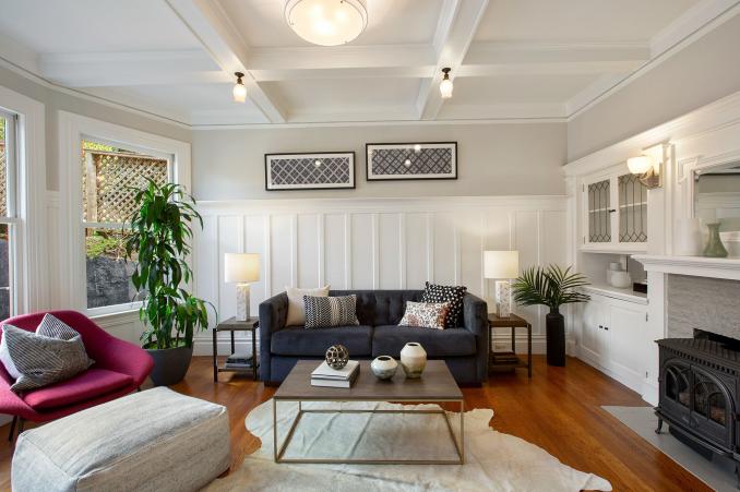 Property Thumbnail: View of the living room, showing boxed ceilings, wood floors and white wainscoting