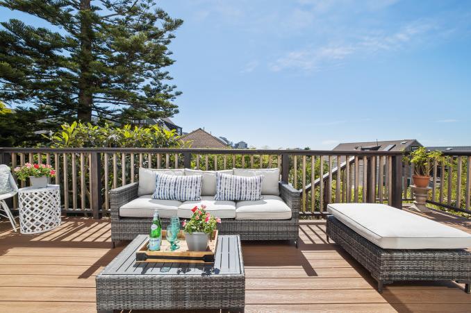Property Thumbnail: View of the deck, highlighting the sun-lit outdoor living area 