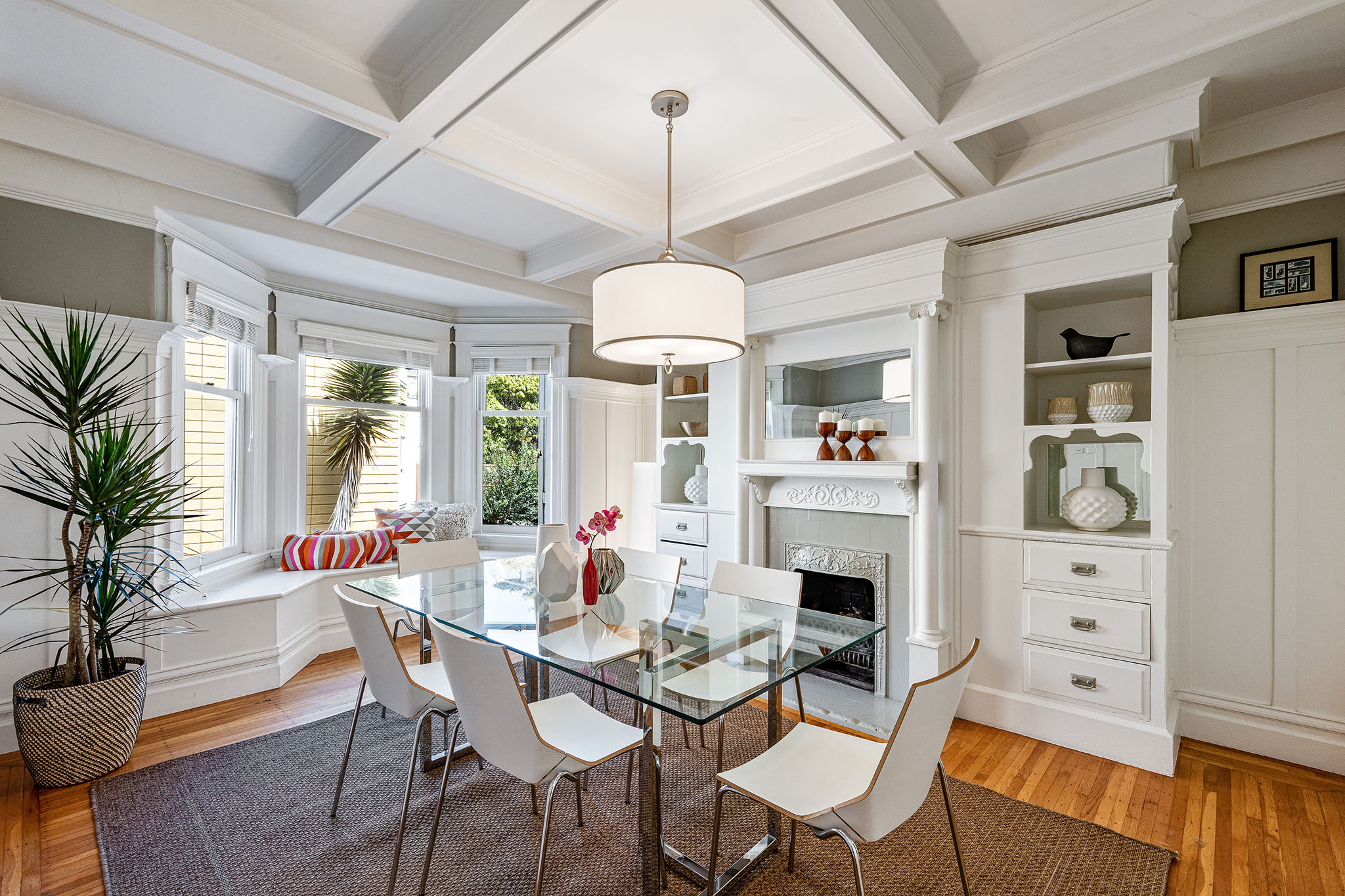 Property Photo: View of the formal dining room, featuring boxed ceilings and wood floors
