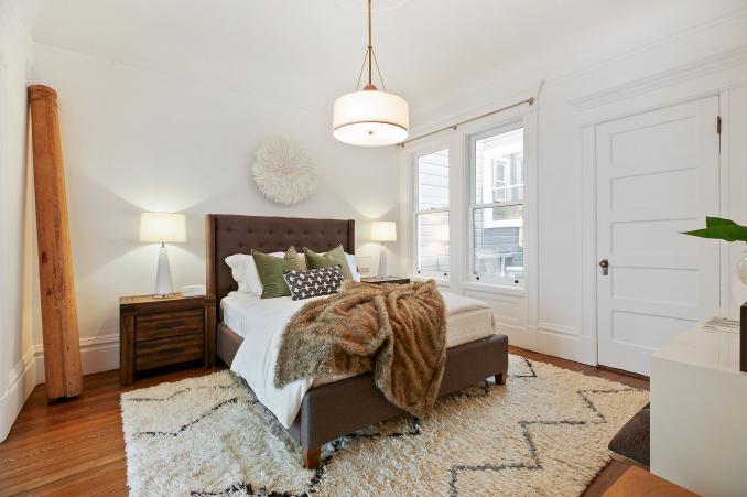 Property Thumbnail: View of a bedroom with wood floors and two large windows