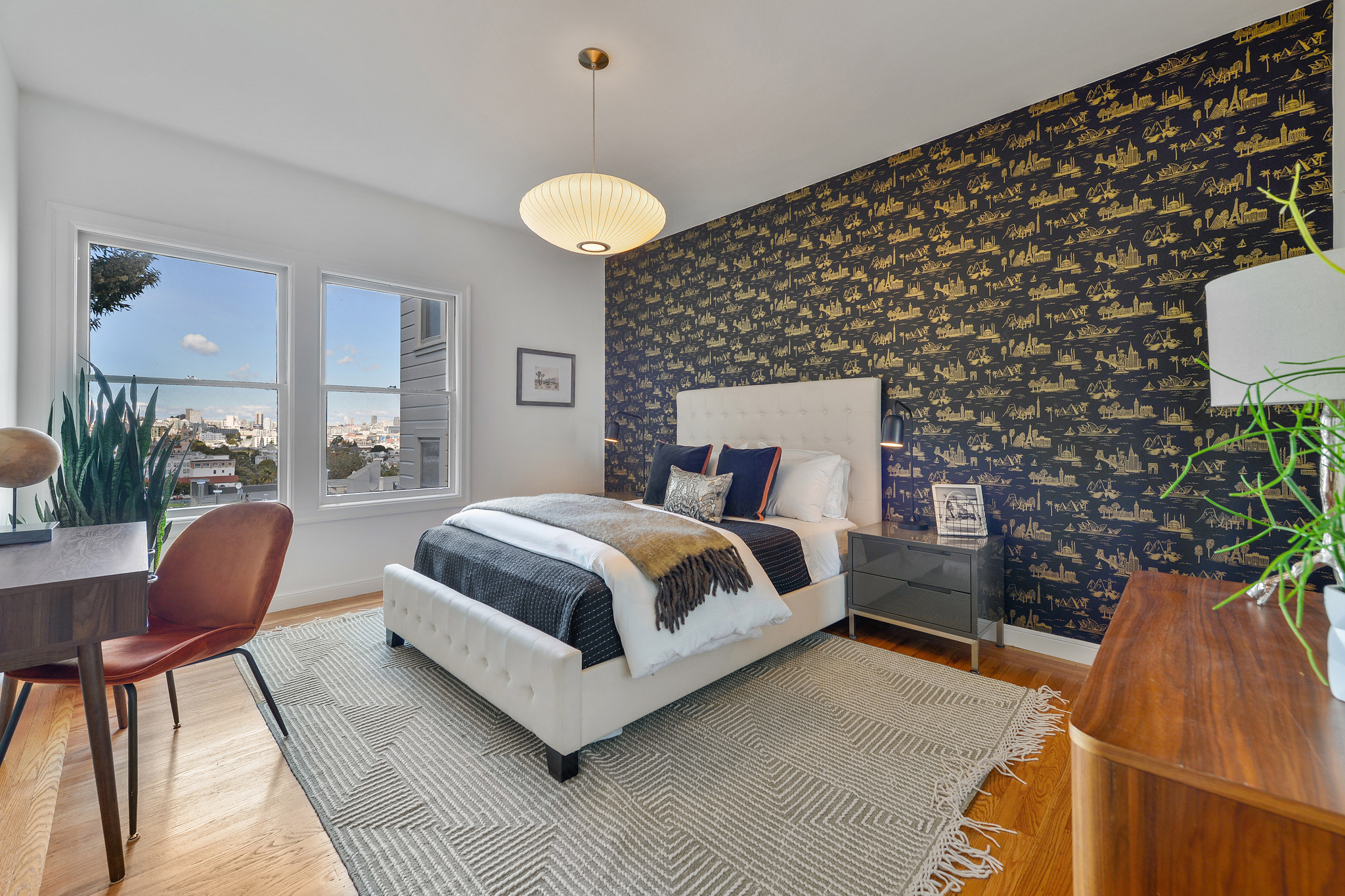 Property Photo: Large bedroom with wood floors and views of Delores park