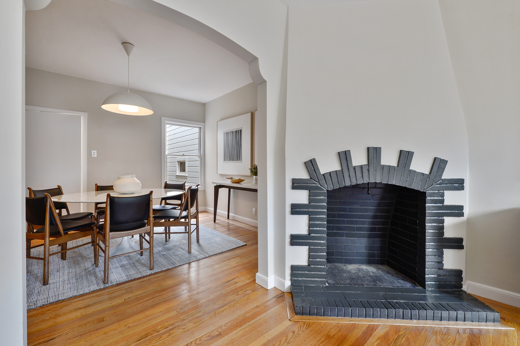 Property Photo: Close-up of ab art deco fireplace with painted brick