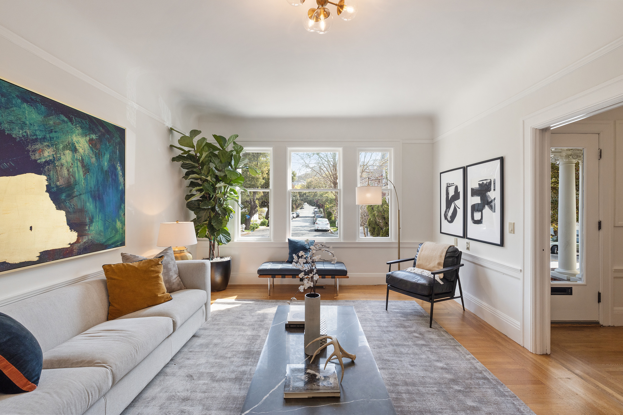 Property Photo: Living room with white wood trim