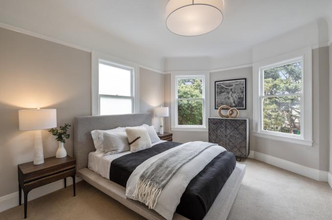 Property Thumbnail: Large bedroom with three large windows