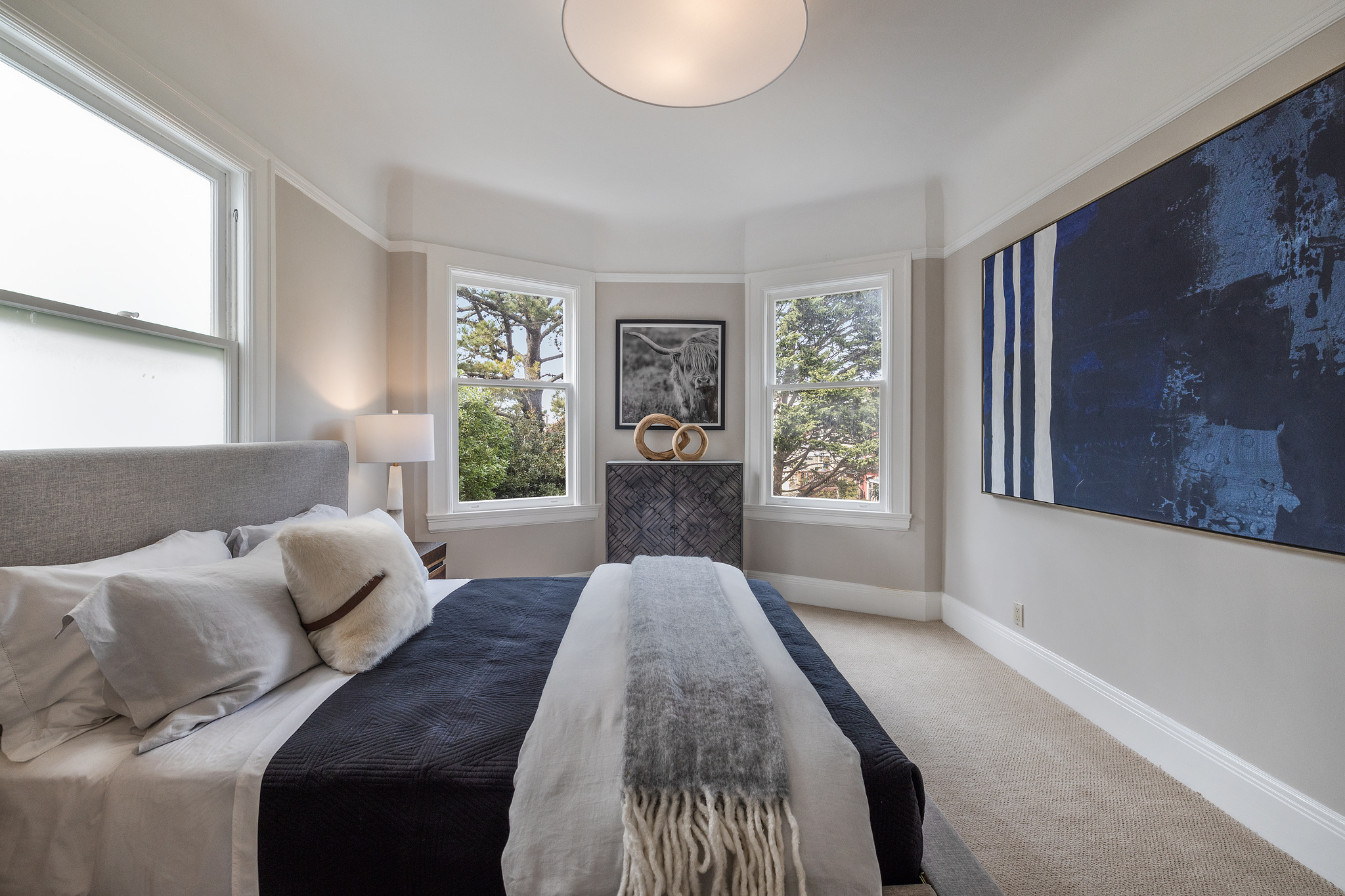 Property Photo: Long view of the bedroom with views of trees