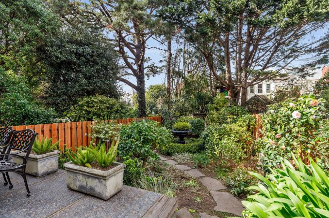 Property Thumbnail: A stone path leading through a garden