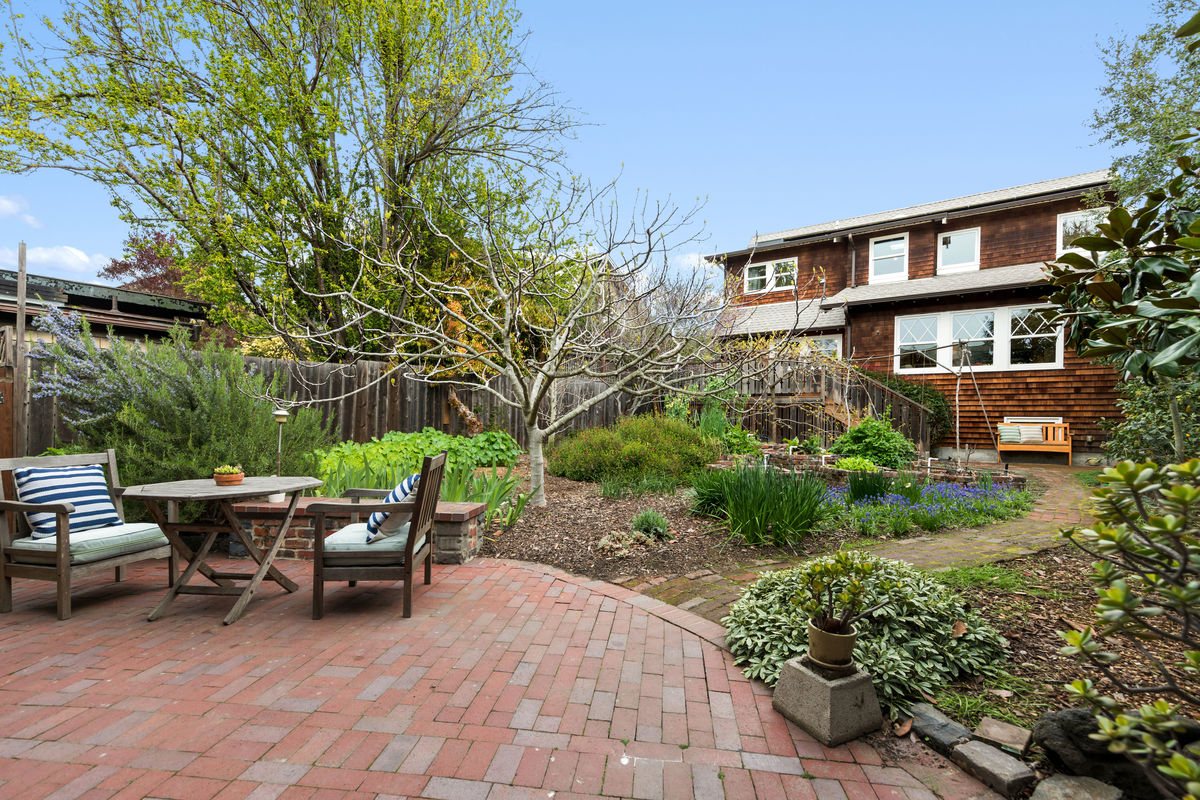 Property Photo: Brick outdoor patio with dining area