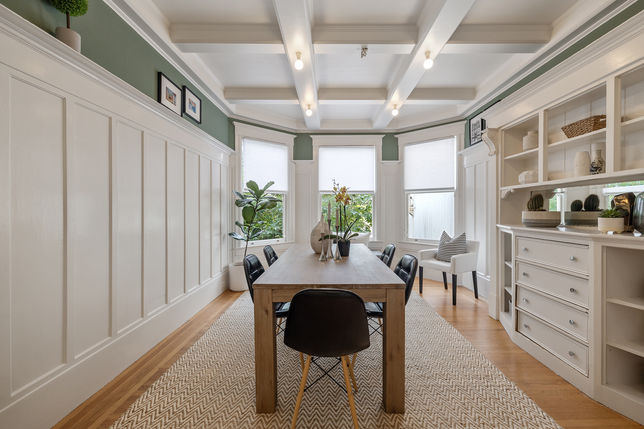 Property Photo: Formal dining room with boxed ceilings and wood floors