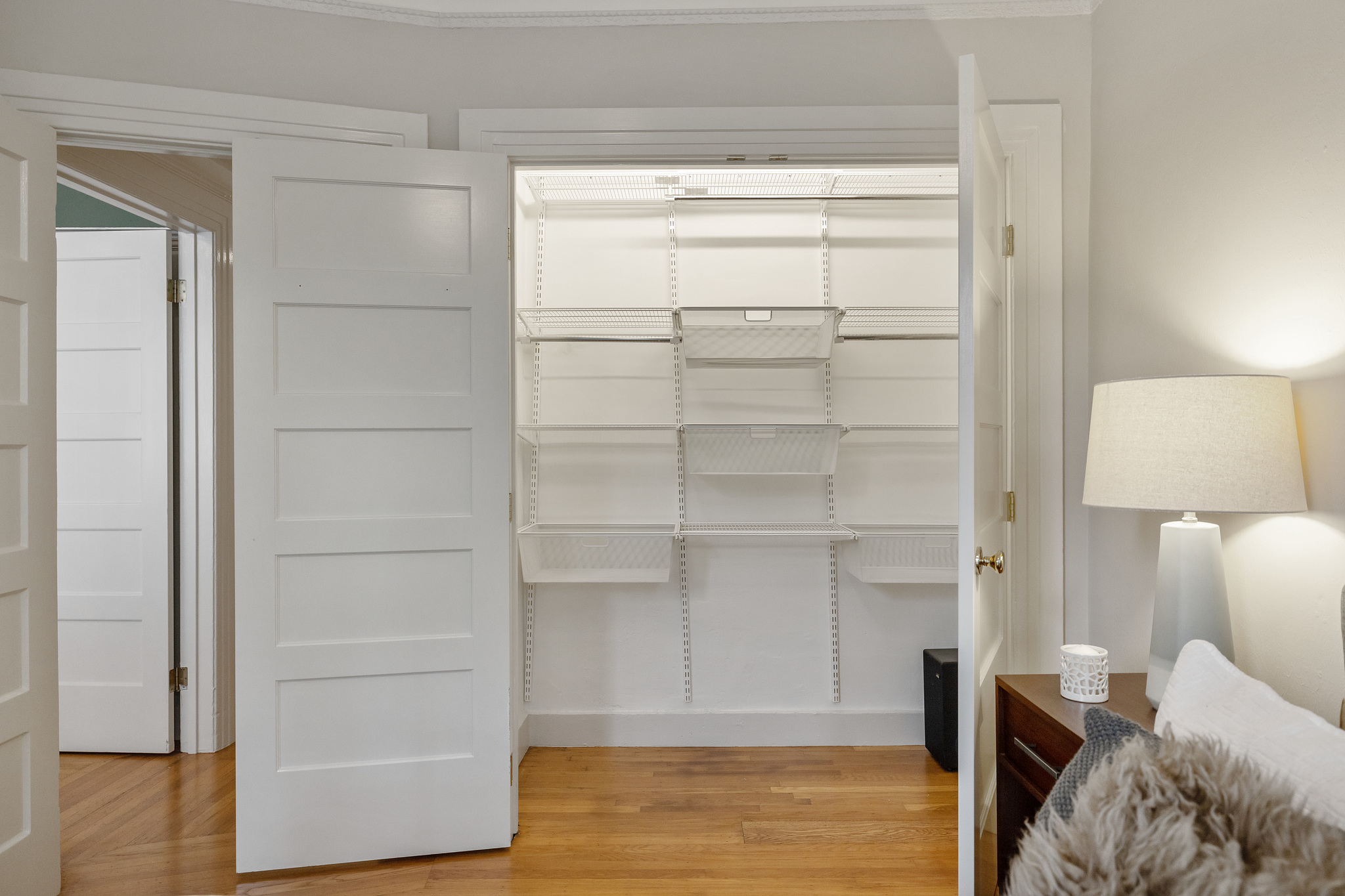 Property Photo: View of a large closet with shelving 