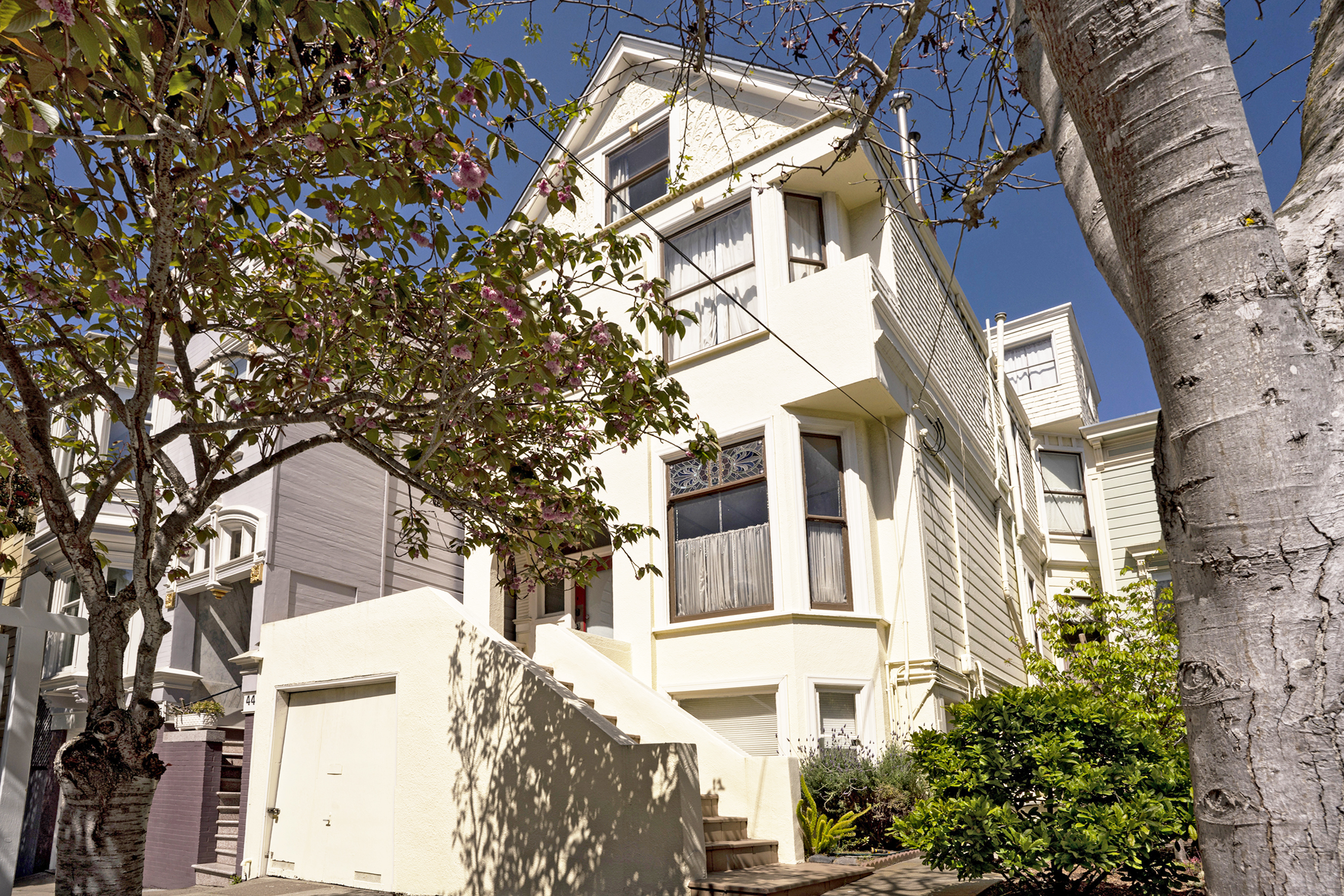 Property Photo: Front exterior of 38 Lyon Street, featuring a light tan facade
