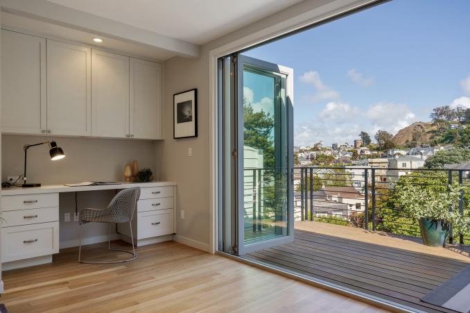 Property Thumbnail: Open French doors show a view of Cole Valley