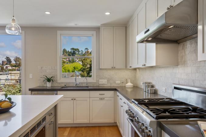 Property Thumbnail: View of the kitchen showing the sink with large window overlooking Cole Valley