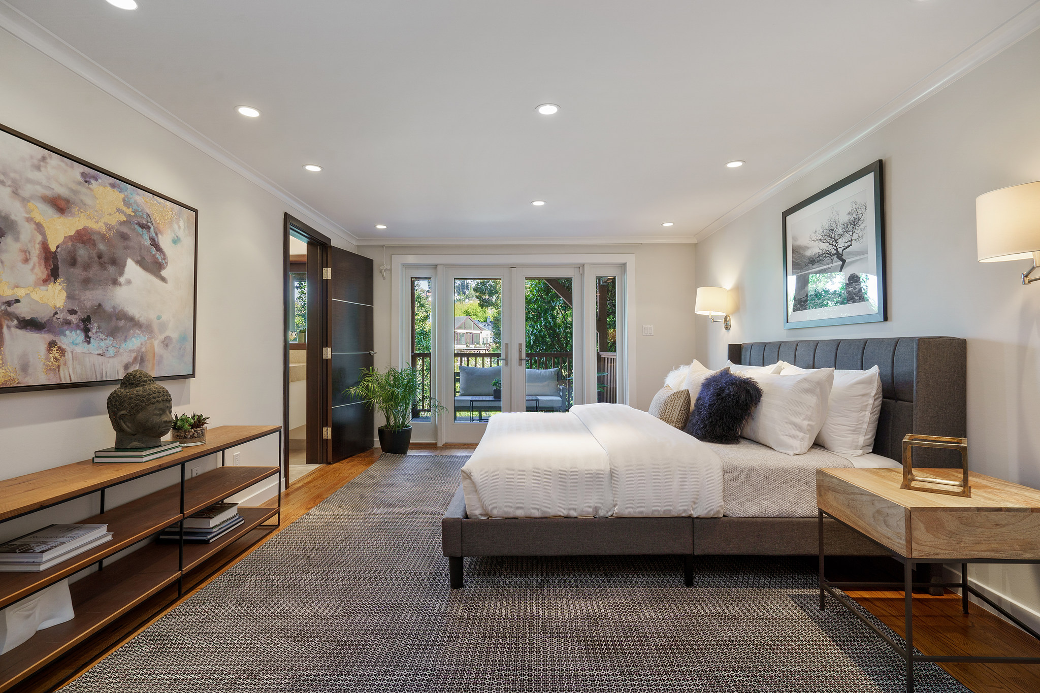 Property Photo: Lower bedroom suite with glass doors leading out