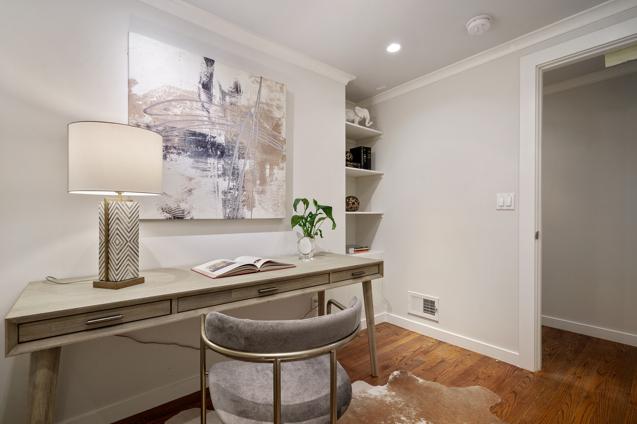 Property Photo: Office with light grey walls and crown moulding 