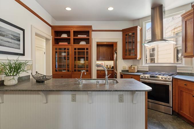 Property Thumbnail: View of the kitchen, showing an island cabinet with sink