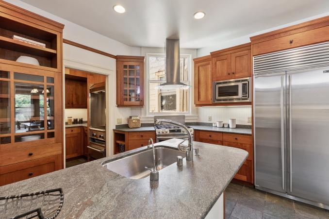 Property Thumbnail: Kitchen, featuring wood cabinets and large window