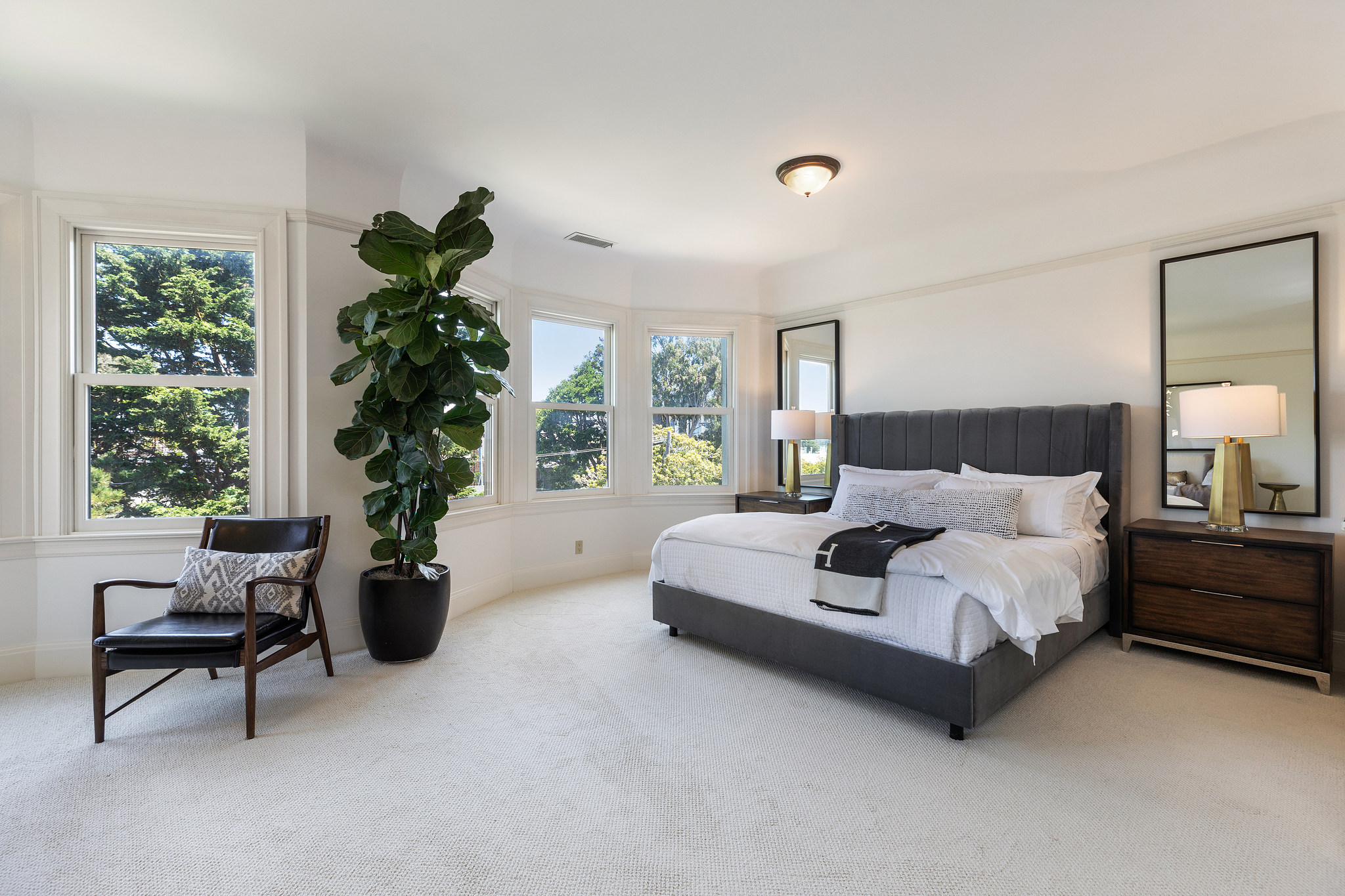 Property Photo: Bedroom with carpet and bay windows