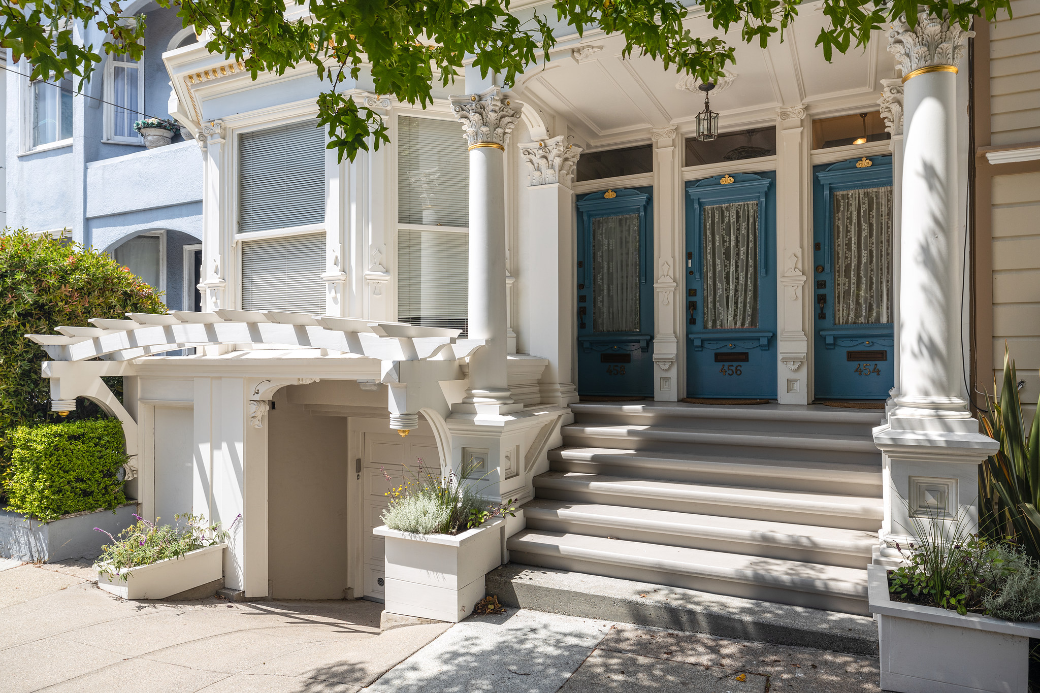 Property Photo: Front entry to 454 Frederick Street, showing three blue doors