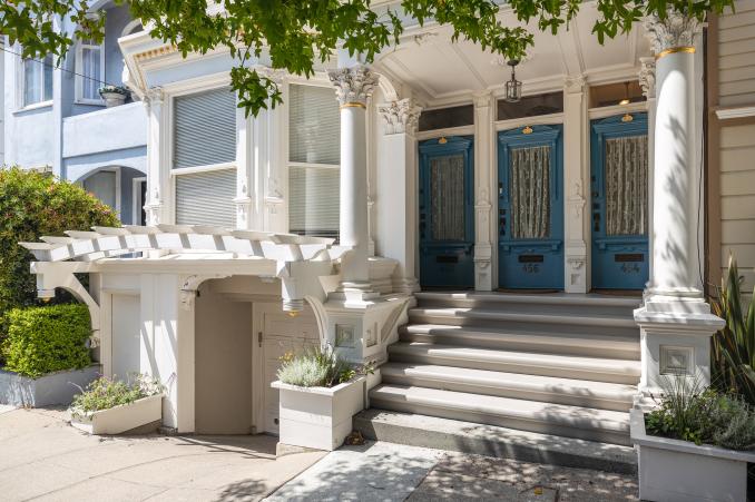 Property Thumbnail: Front entry to 454 Frederick Street, showing three blue doors